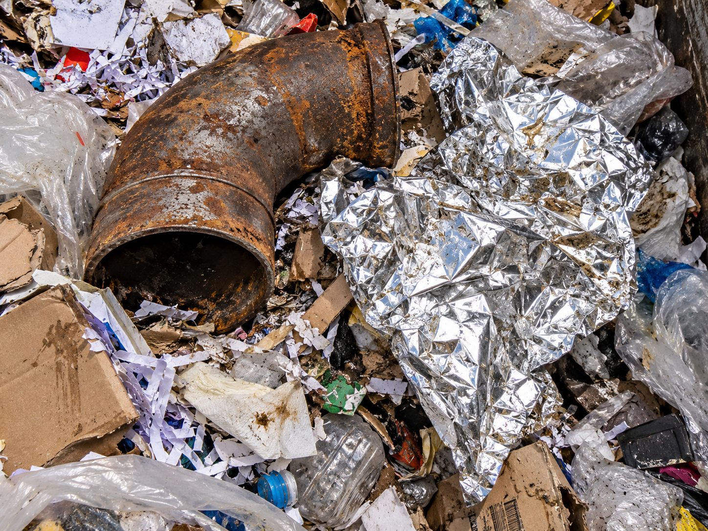Rusted industrial steel bolt, the kind of metal contaminant that destroys an RDF shredder